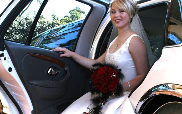 bride in wedding hire car